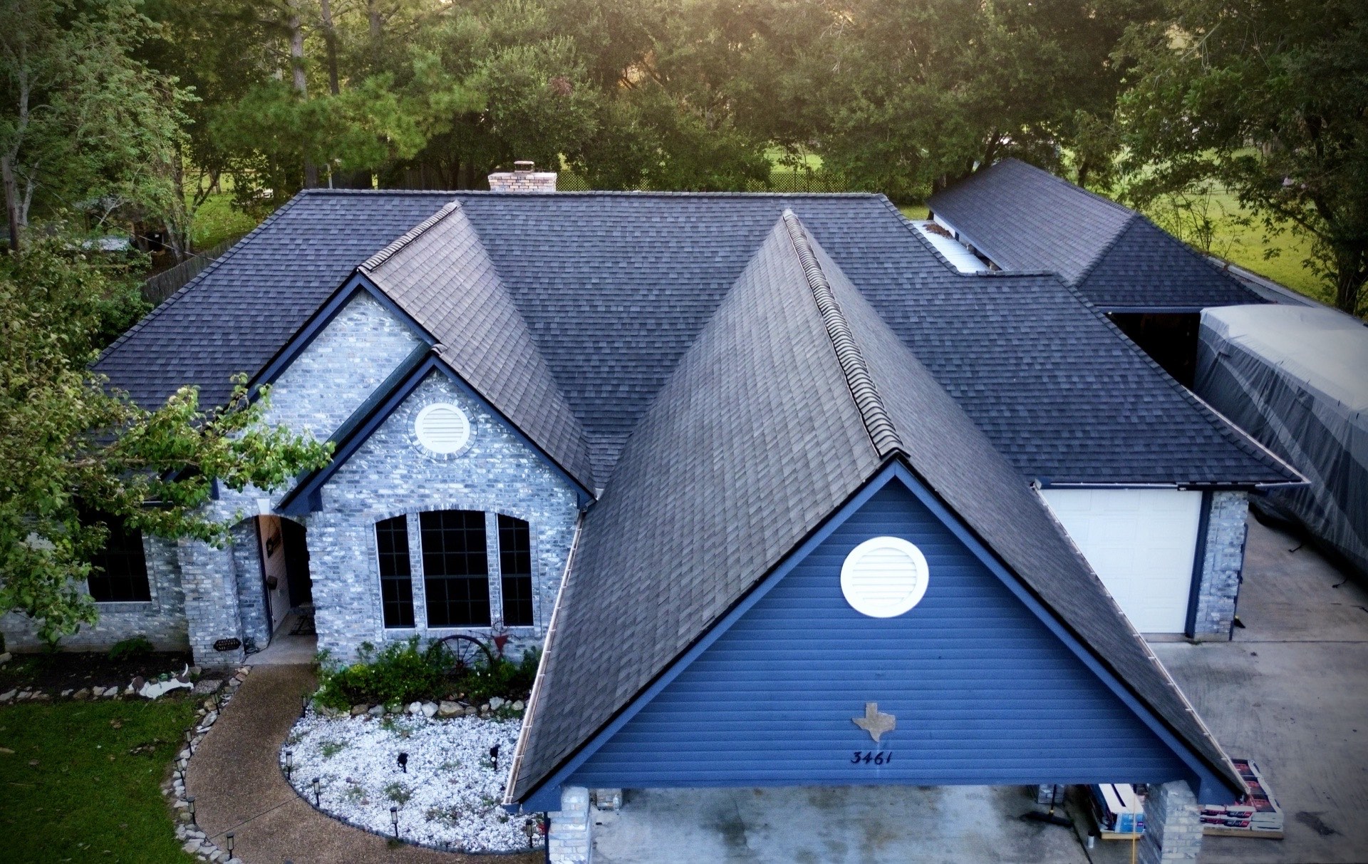 Storm-damaged shingle roof being repaired by Recon Roofing in La Porte, TX